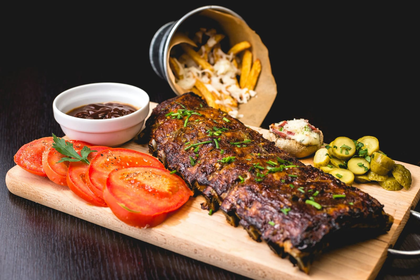 Delicious smoked brisket and grilled meats on a BBQ spread.