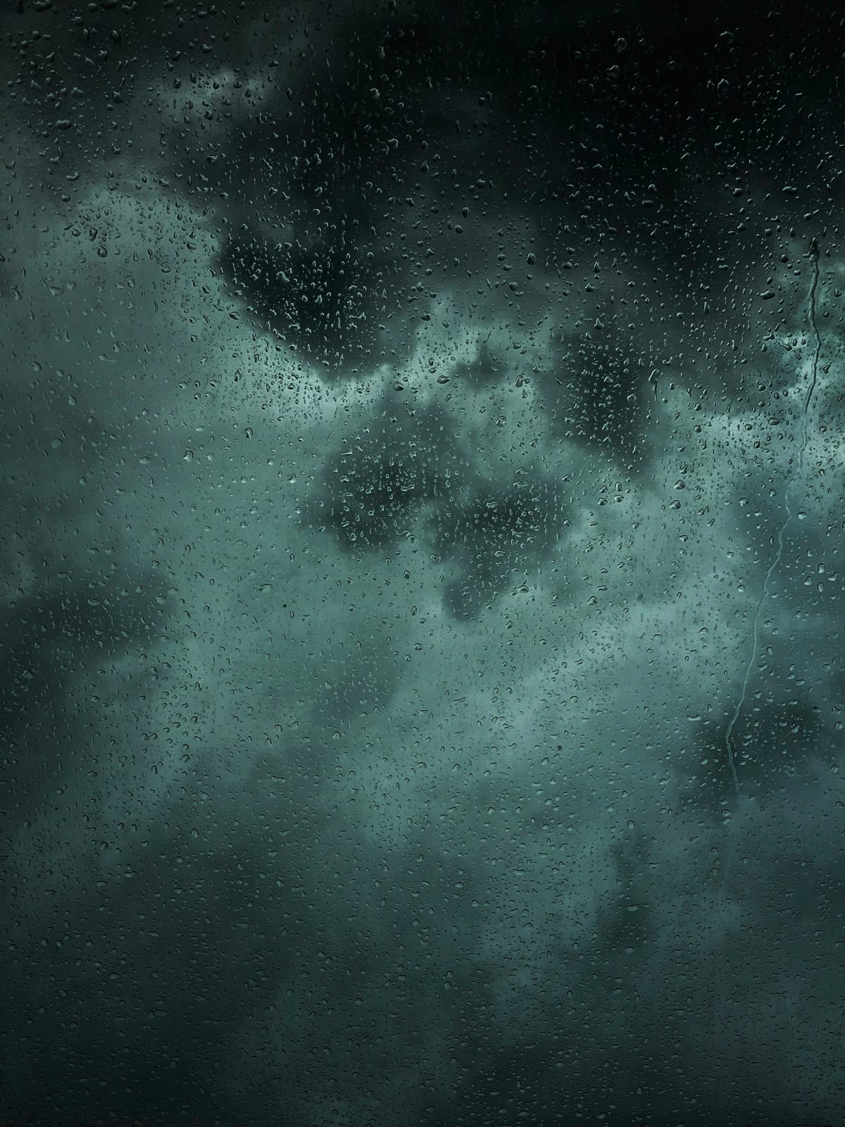 Heavy rain flooding streets with water pooling on roads.