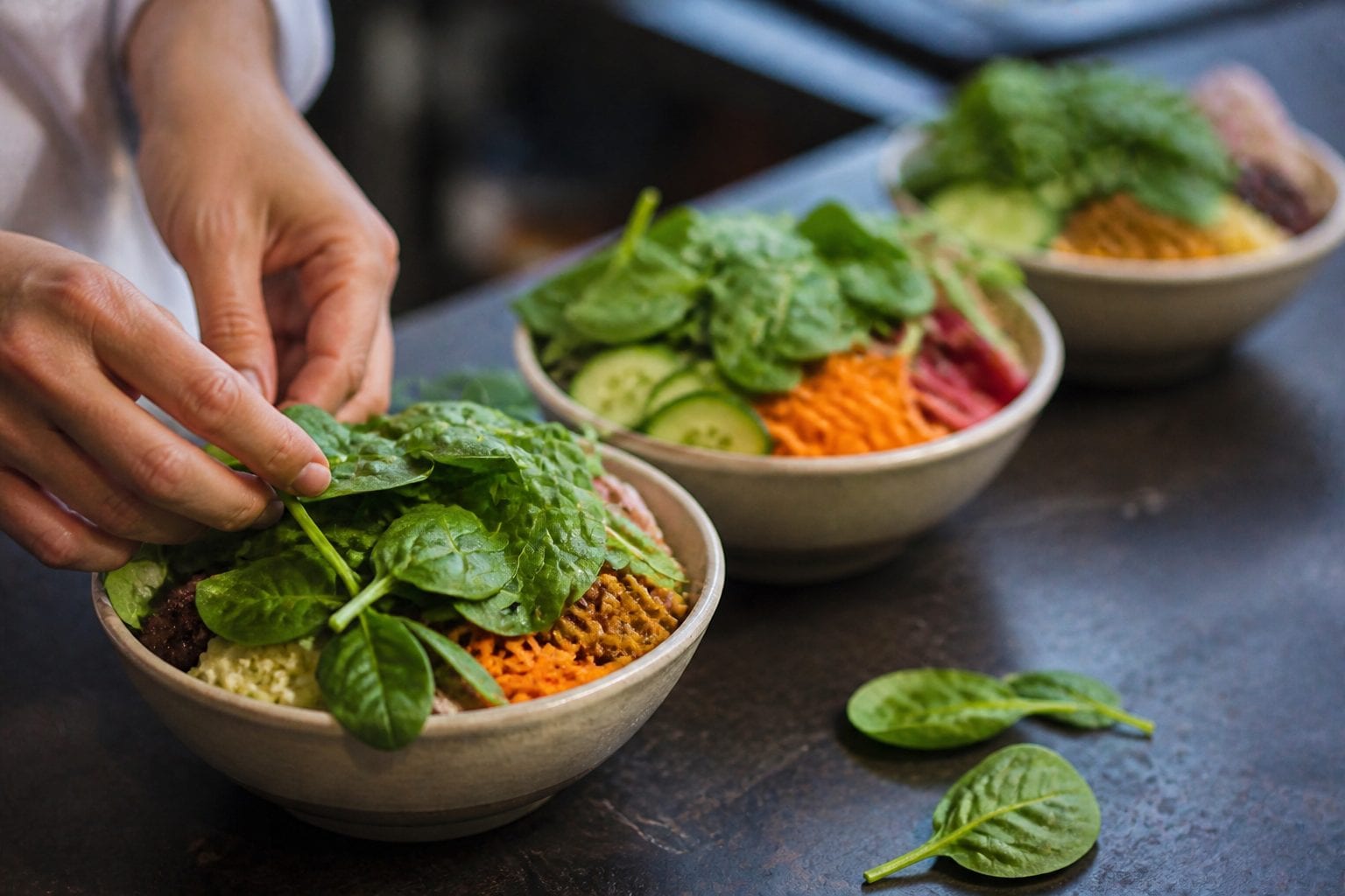 Poke bowls lined up for a comparison table
