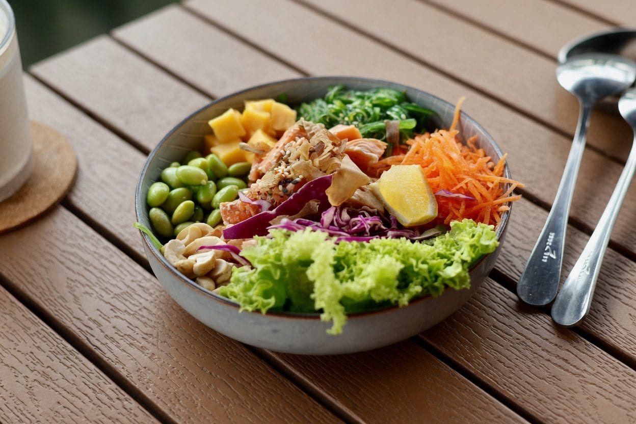 Assorted poke bowls with colourful toppings