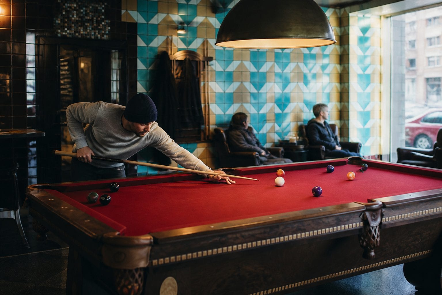 Pool tables and bar atmosphere at Midway Pool Hall in Old Ottawa South