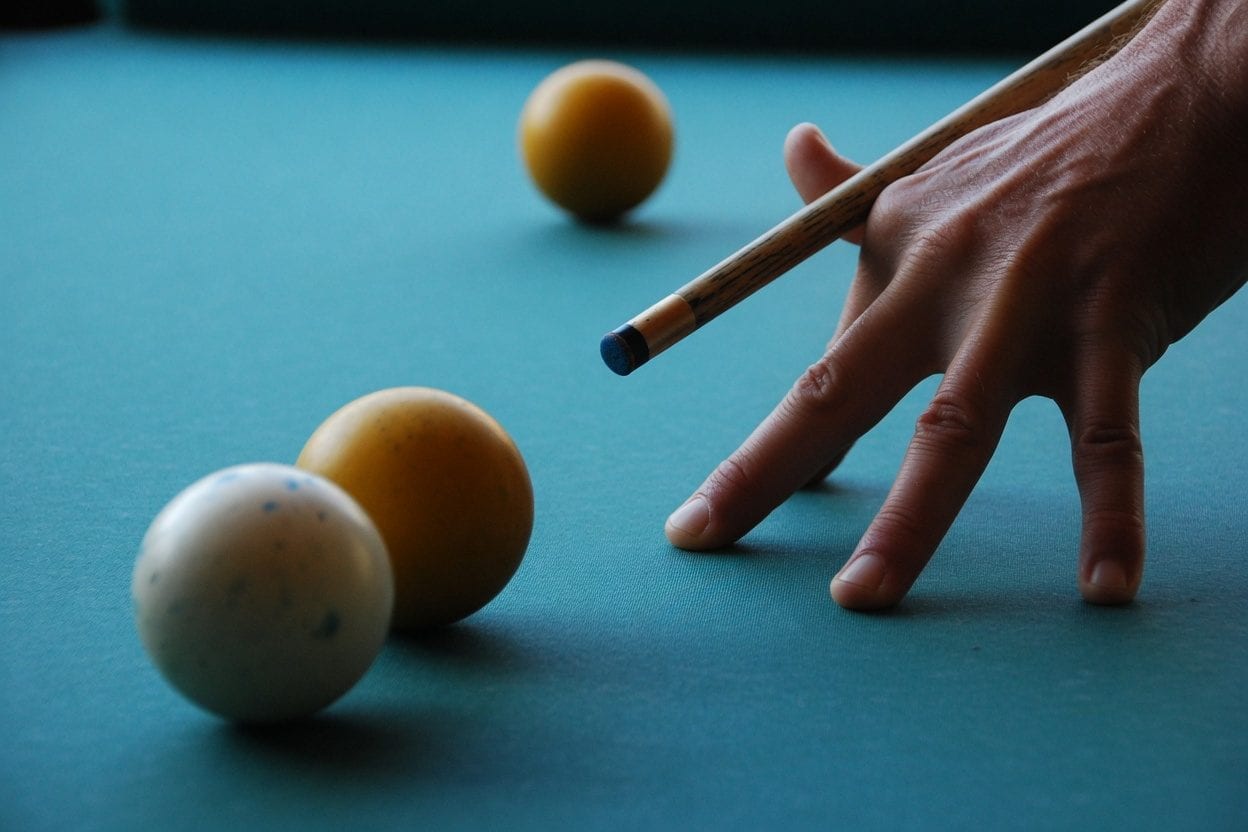 Snooker balls set up on a green baize table