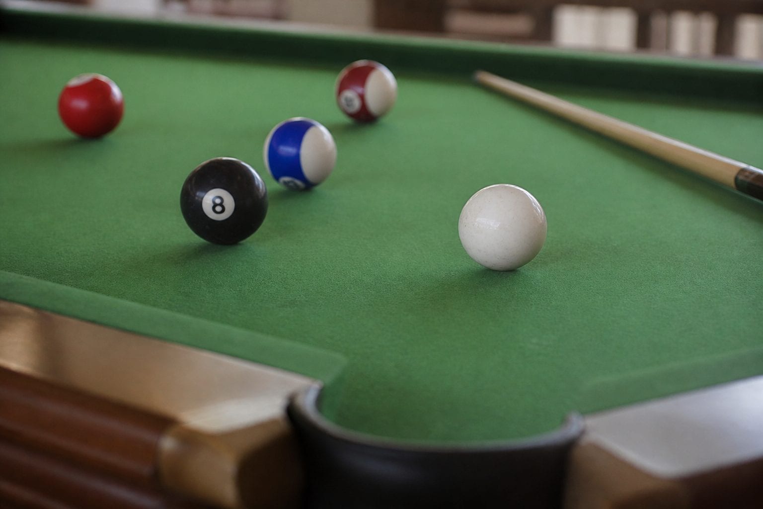 Cue ball and rack on a pool table