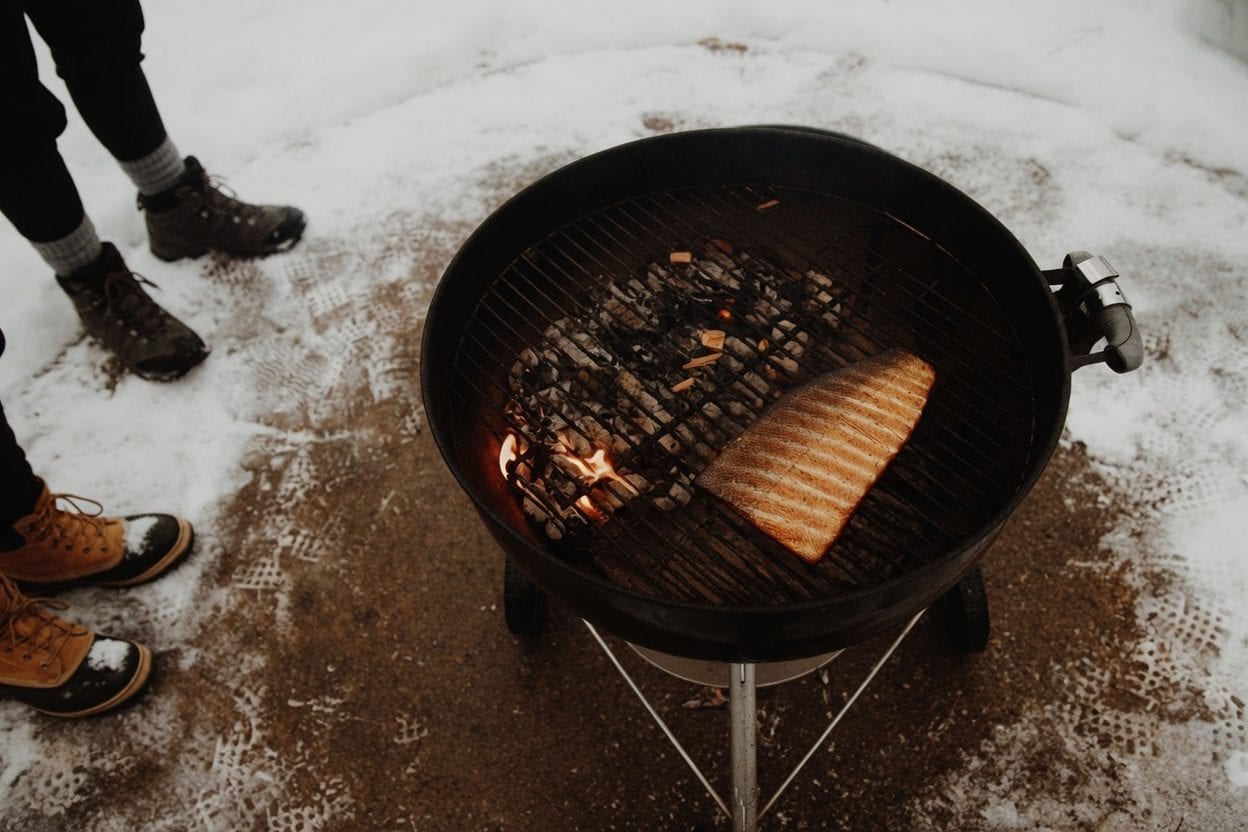BBQ ribs and grilled meat on a smoker with rich smoky char