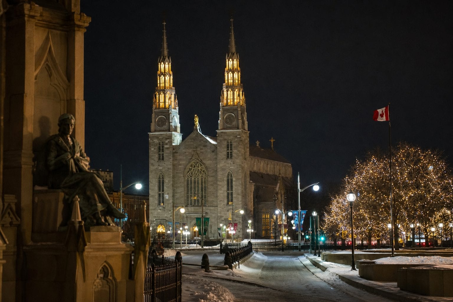 Parliament Hill lit up at night in winter.