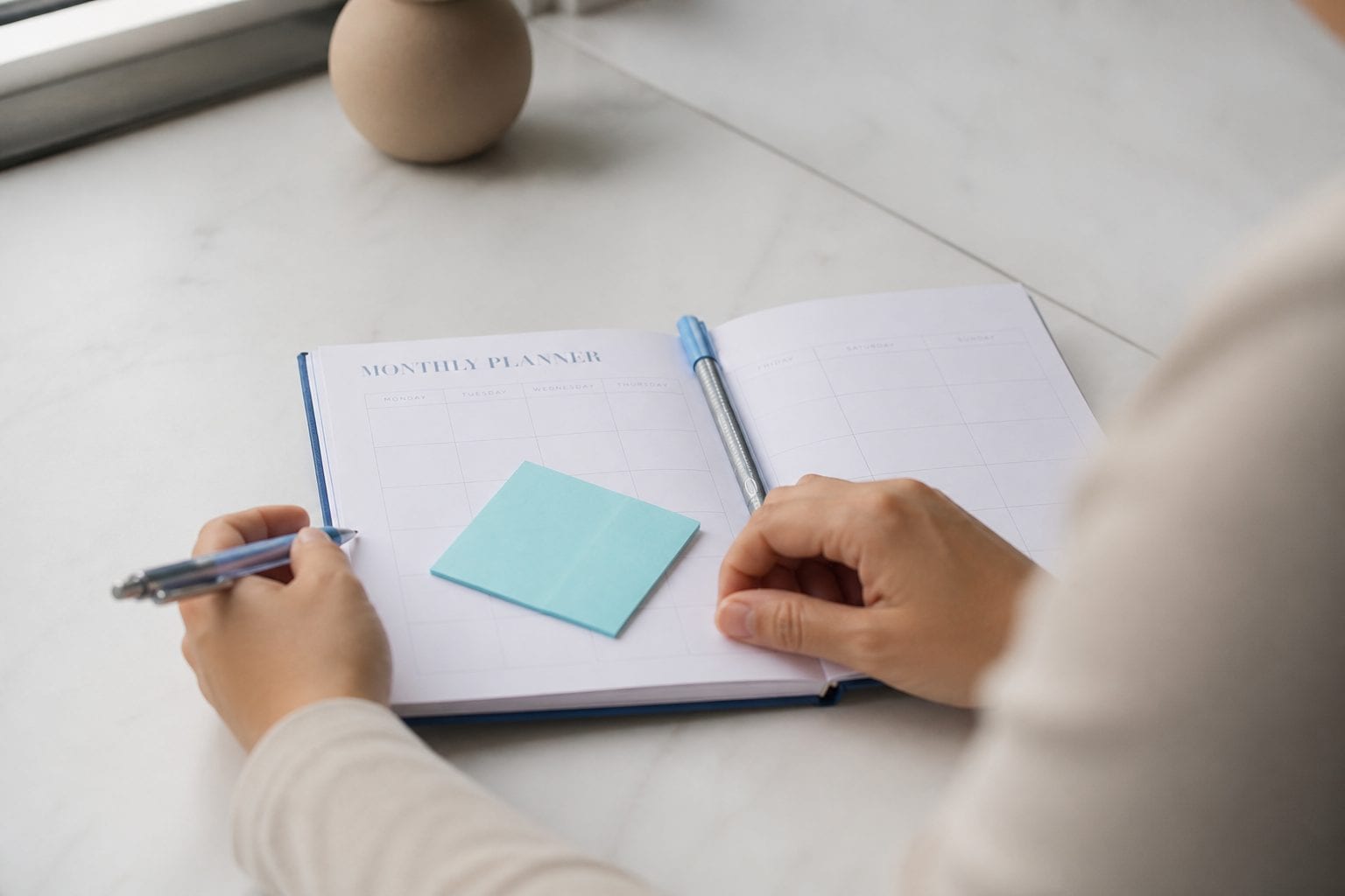 Notebook and pen for planning.