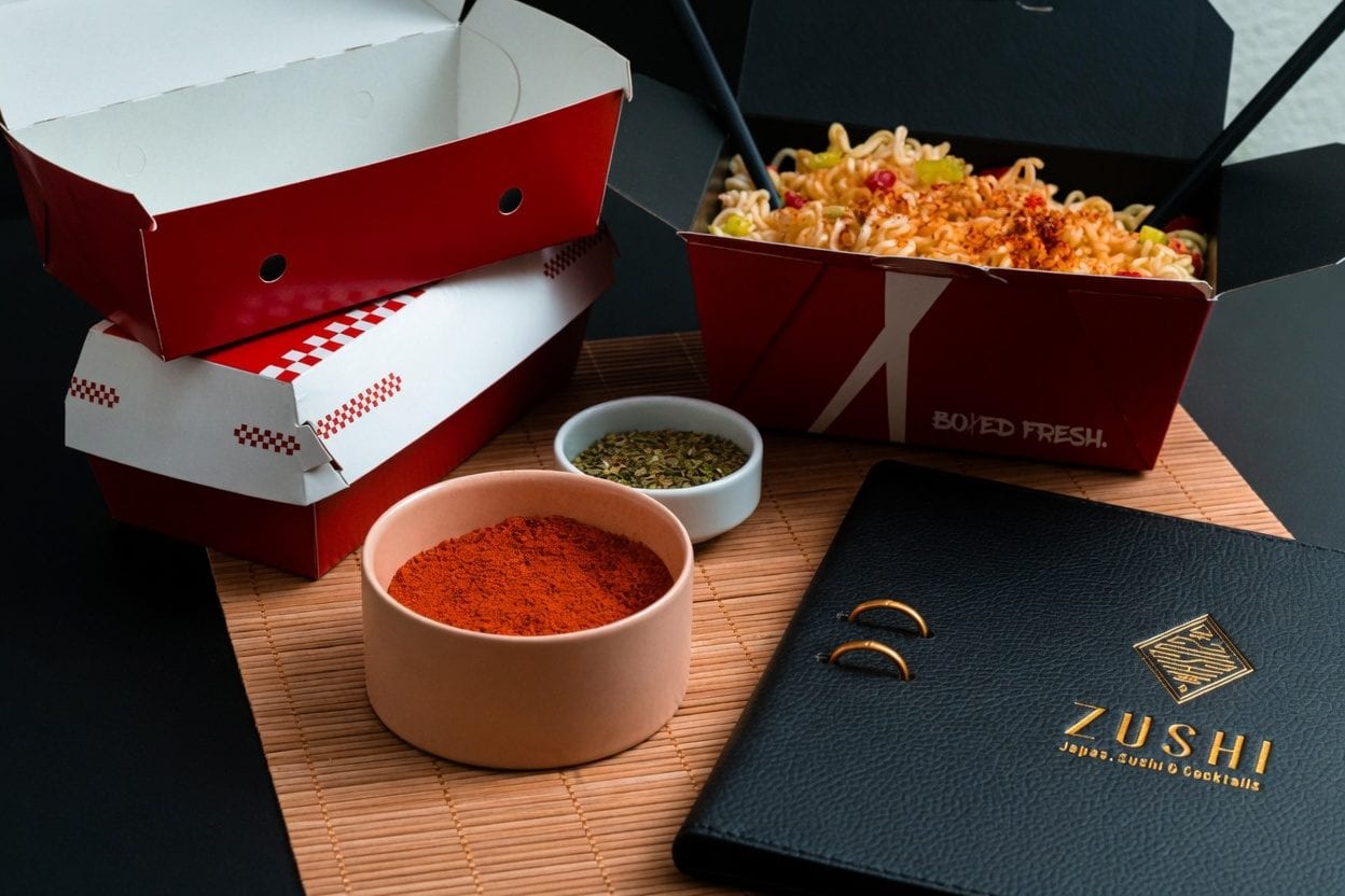 Takeout bag with Thai food containers