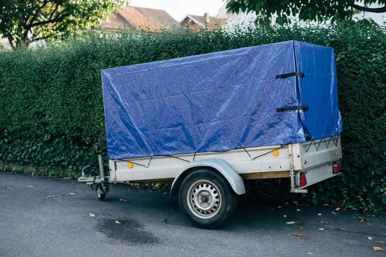 Driver checking documents before towing