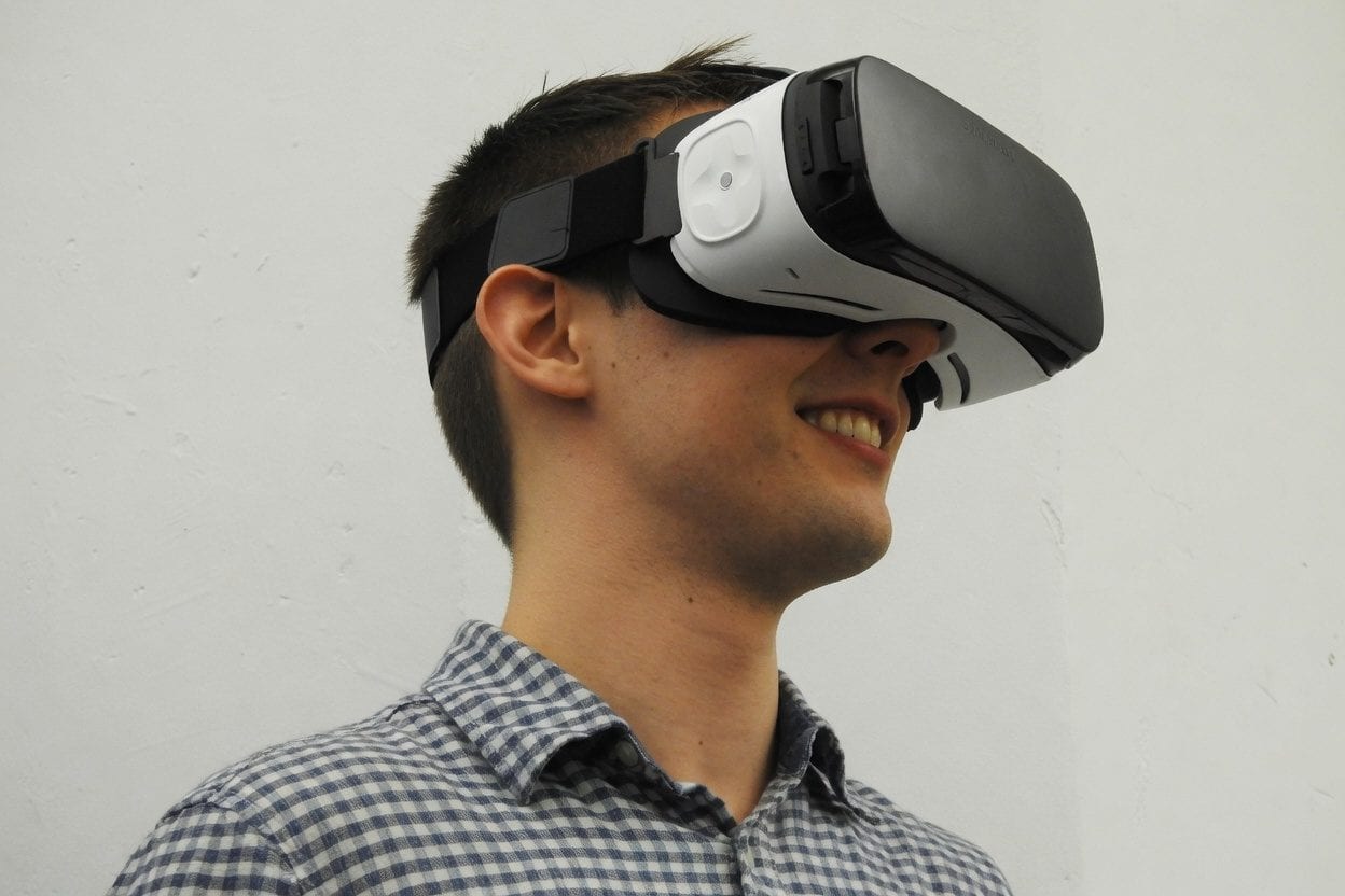 Group in full-body VR gear with haptic vests