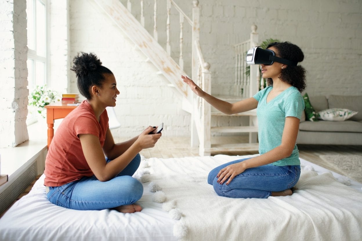 Group taking off VR headsets and laughing