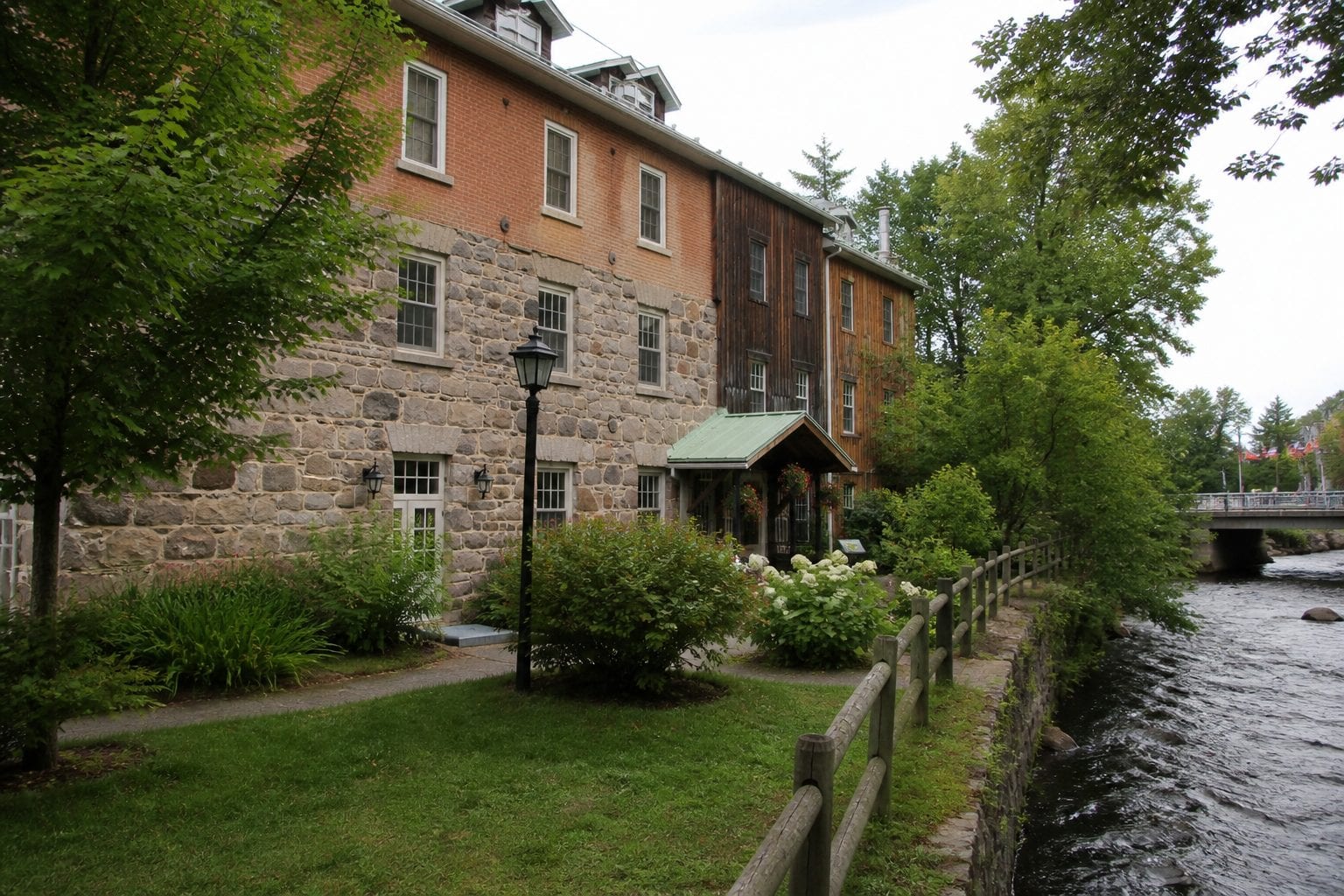 Wakefield Mill stone building and riverside hotel setting