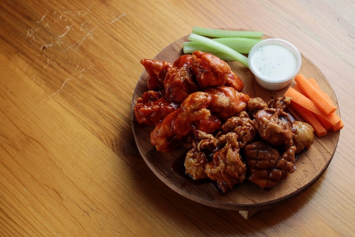 Chicken wings platter with sauces and celery