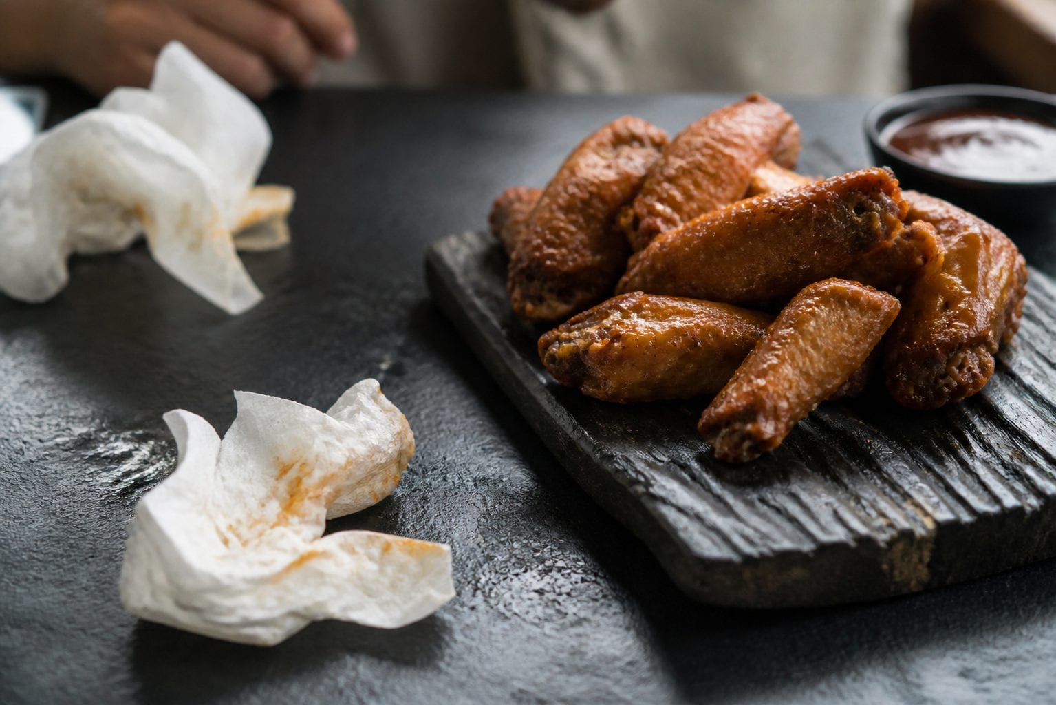 Saucy wings with messy napkins